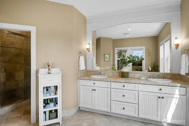 The bathroom is done in quiet neutral tones to create a peaceful environment.