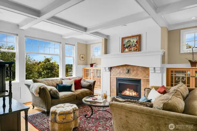 This elegant living room offers quiet refinement and a comfortable place to gather. The views of big blue sky, the lake and mature plantings are outside this window. This room is light-filled due to the south-facing windows.