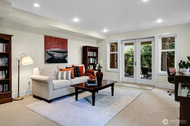 Lower level touts a HUGE rec room- great for gathering, football games, or parties. The French doors spill out to a lovely private patio.
