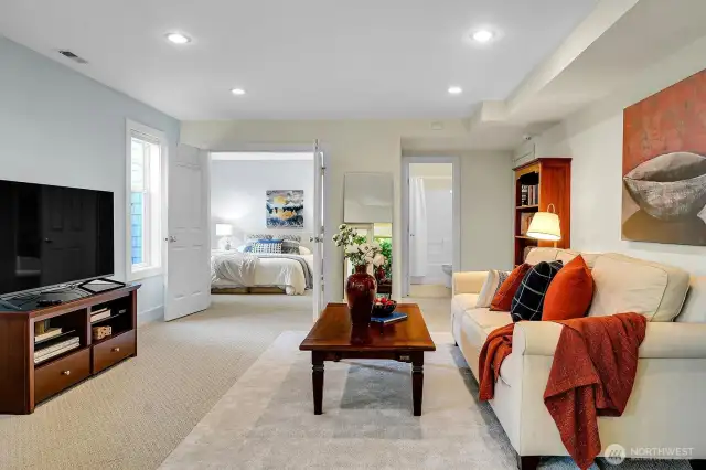Looking back into the rec room as well as the 5th bedroom in the home. This bedroom is often used as a guestroom- could be for a nanny, grandparents or just visitors.