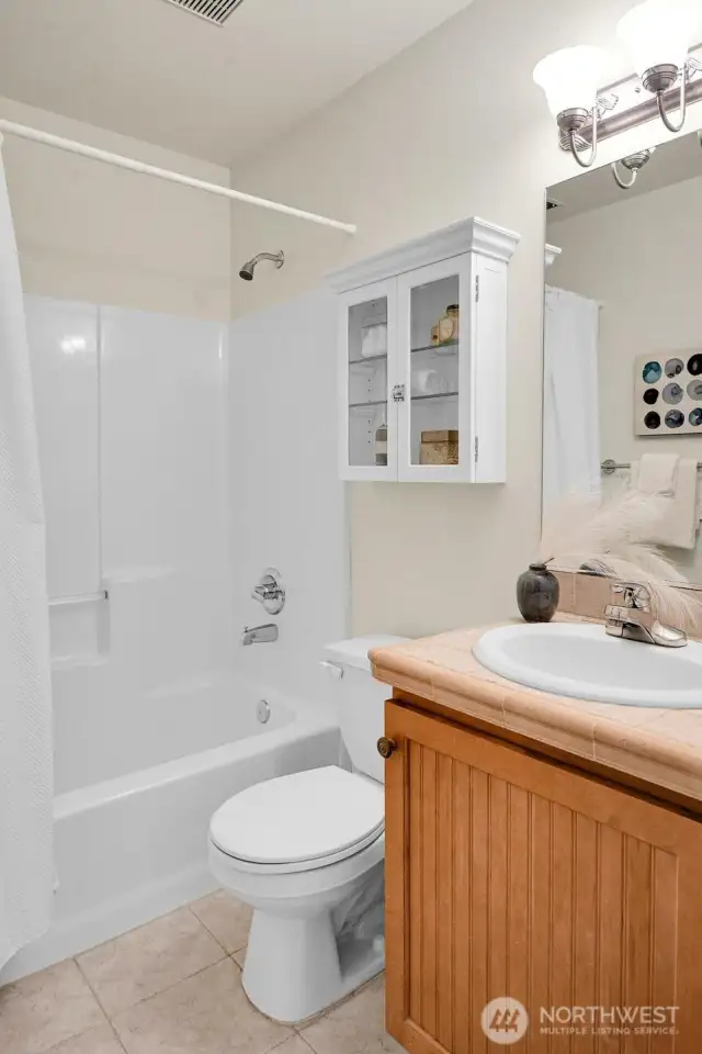 This is the full bath adjacent to the guestroom and laundry.