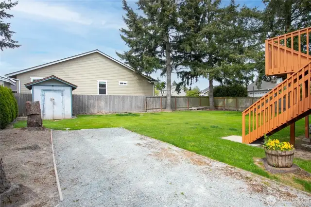 Backyard with gravel overflow/RV parking