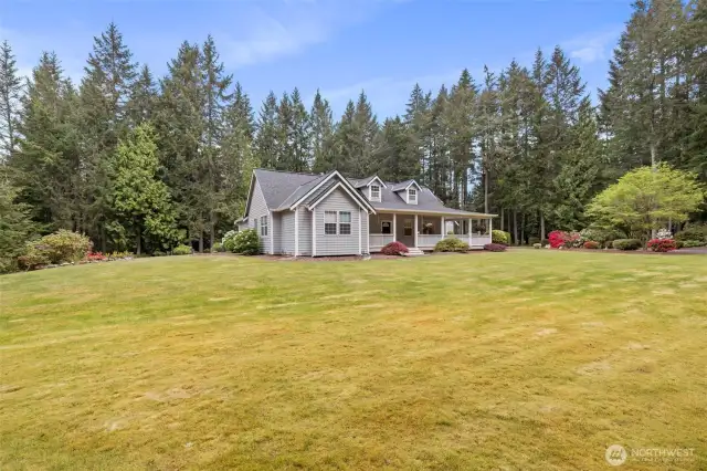 The house sits regally in the center of the property, allowing for natural light in every window and large open space all the way around.  Trees and shrubbery line the perimeter of the property, allowing for maximum privacy.