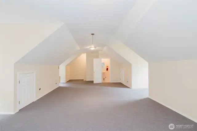 Enormous loft space above garage, includes a half bathroom