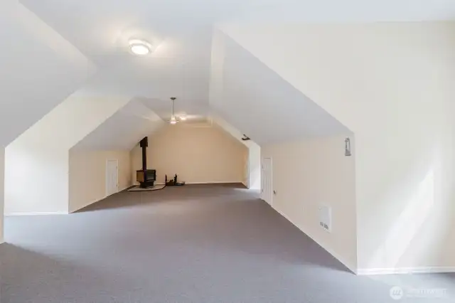 Loft space also has a fireplace.