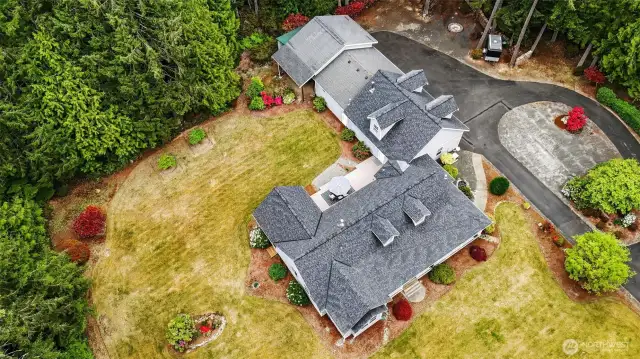 This property is surrounded by a sprinkler system, making yard work easier.