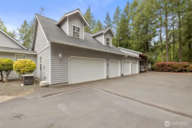FIVE CAR GARAGE WITH 2 RV/BOAT CARPORTS ATTACHED.  Garage is heated, insulated, and oversized.  You can bring all your toys!!!