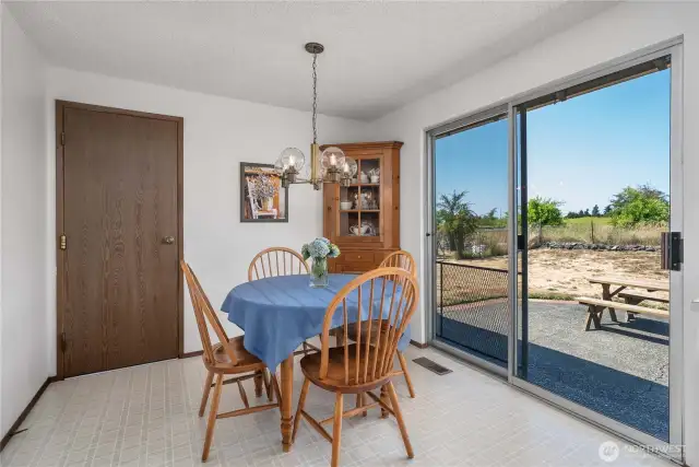 Big eat-in kitchen. Door to the garage and laundry.