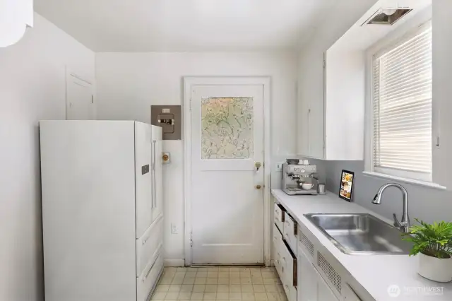 Main floor kitchen has outside access.