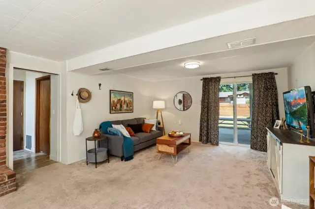 Family room opens out to the patio and huge backyard.