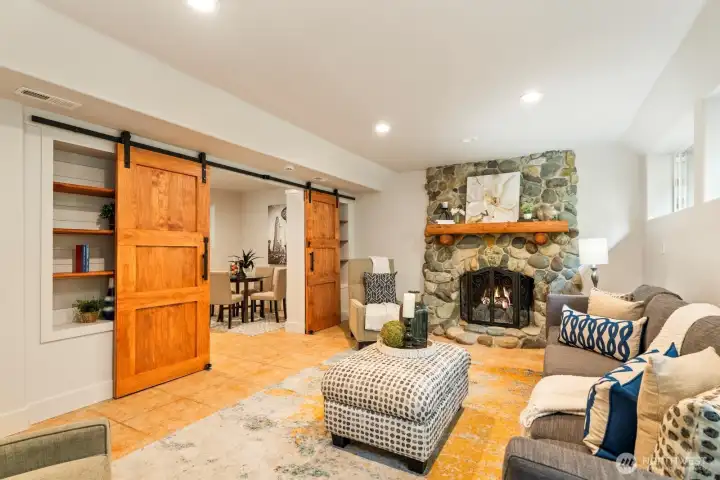 Tremendous flexibility in how you can use the downstairs spaces. The barn doors create a separate room that is perfect for a home office, game room, art studio, or...
