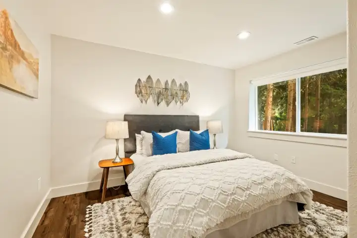 And here's the last downstairs room. Altogether, there are four rooms in the basement including the living area and three additional spaces offering privacy and maximum flexibility.