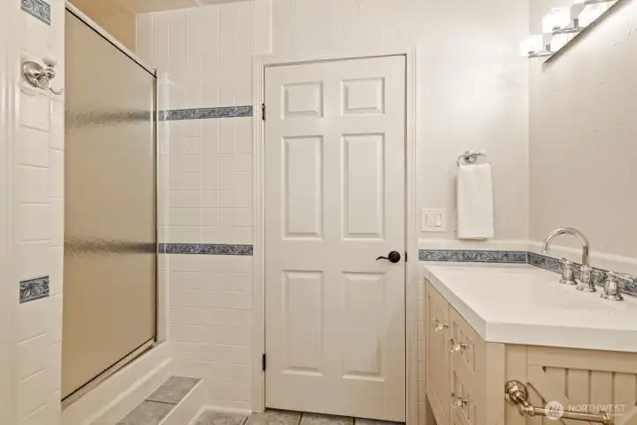 Downstairs bathroom showing the shower and vanity.
