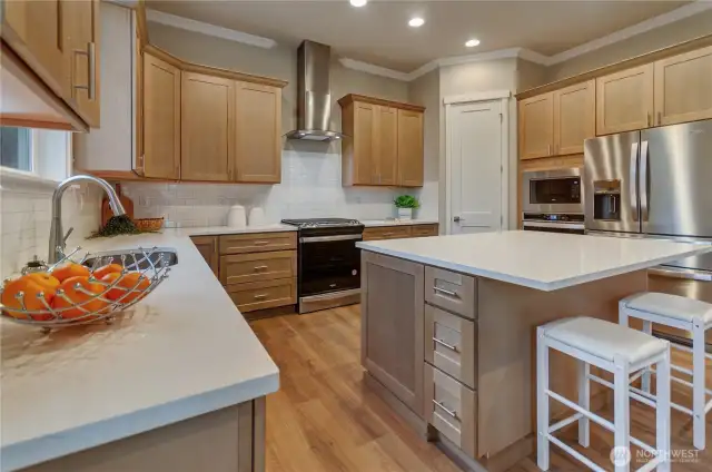 Generous cabinetry makes storage easy while the Whirlpool range, double ovens and refrigeration allow prep and cooking meals and snacks to be easy and without limitation.