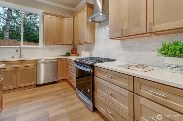Long lasting and proven Whirlpool appliances, including this gas stove/cooktop and stainless finish dishwasher, provide reliability and confidence for many years to come