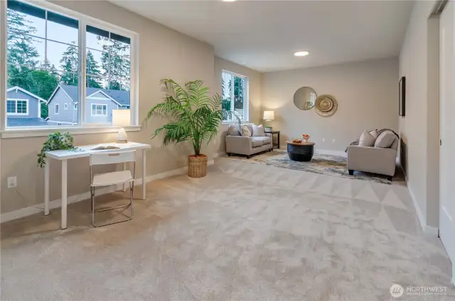 Upstairs is a large bonus area perfect for that home gym, play area or media room.
