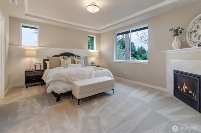 Nothing is more inviting than our primary bedroom with well-positioned windows, durable wall-to wall carpeting, a coved ceiling with painted crown moulding and a custom natural-gas fireplace. So comfortable, you will not want to leave.