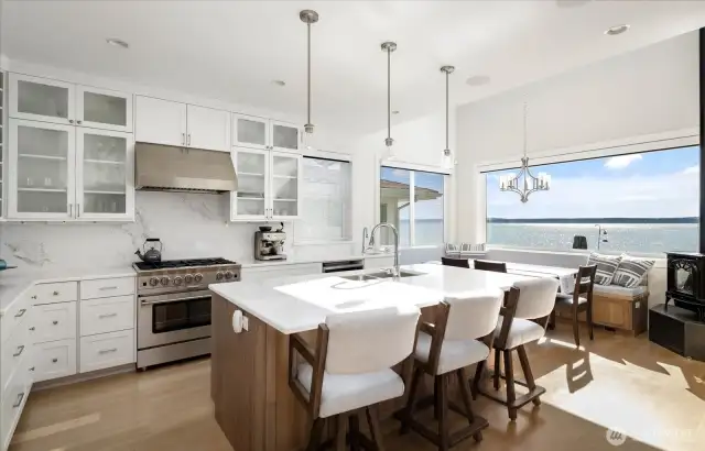 Beautiful waterside kitchen thoughtfully designed for inspired cooking, featuring high-end finishes, smart layout, and sweeping water views.