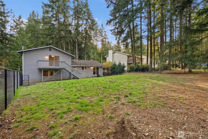 Your completely fenced backyard has lots of room for play, gardening and entertaining!