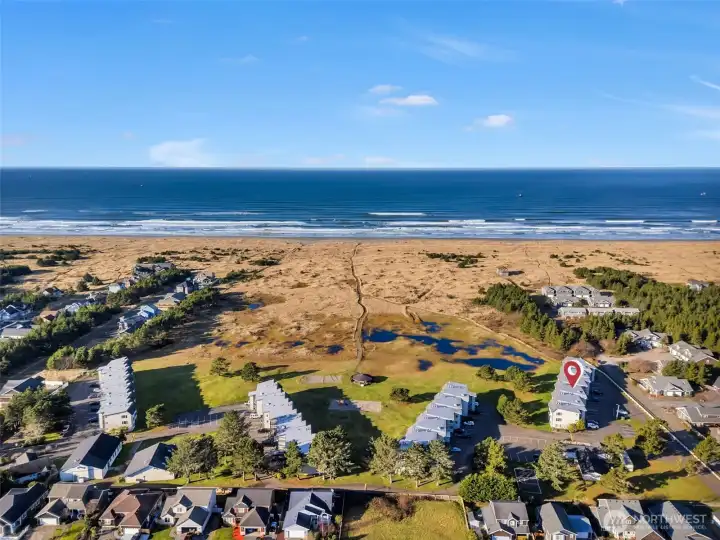 Aerial view looking towards the Pacific Ocean. Units 419 and 420 are in building "D" on the right side of the photo.