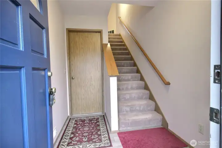 The entry going upstairs as well as to the garage.