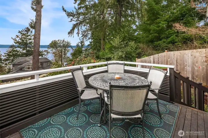 The large deck is conveniently located just steps off the kitchen.