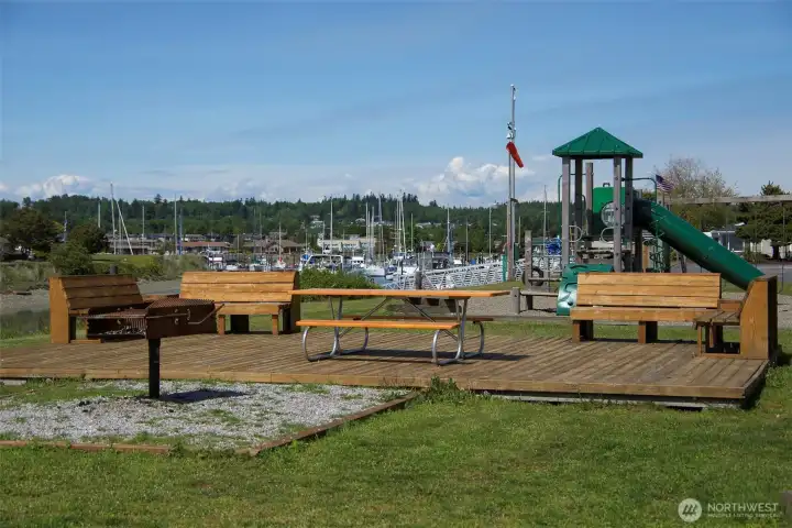 one of several playgrounds and park benches