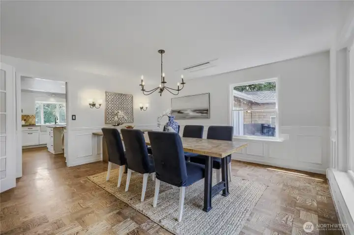 All the floors in the home have been newly refurbished, including the magnificent parquet in this dining room. Views to the lake from here make your your dining experience truly special.