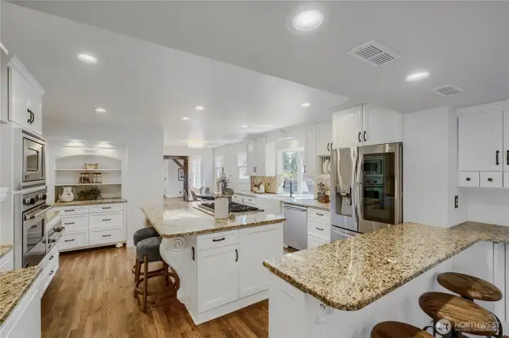 Centralized kitchen to cater directly to the dining room, the living room and the family room. Tremendous views into the backyard to watch the action. Keep your eyes out for the deer!