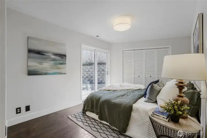 A private guest suite on the main floor with the convenient slider leading to the back deck and yard. The bathroom and laundry are adjacent.