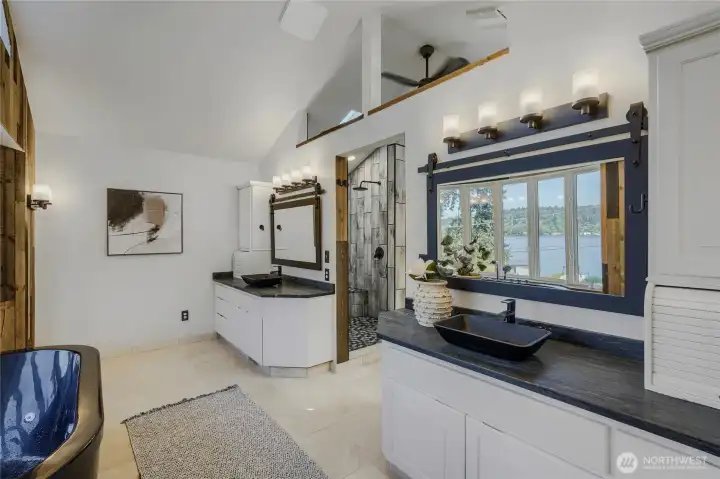 Travertine tile is complimented by a bit of history: the wood accents from a fallen cedar tree the family's farm in Oregon.