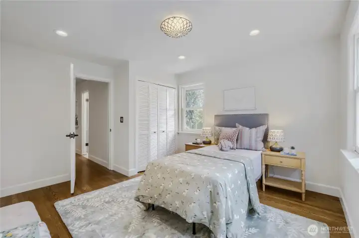 And the SE bedroom displaying one of the beautiful leaded ceiling lamps that you will find throughout the home.