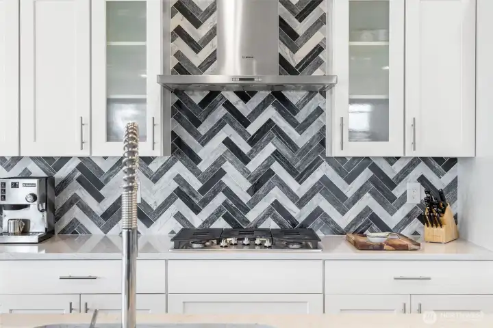 Custom tile upgrade by the current owner. This home is better-than-new with finishes beyond standard builder finishes.