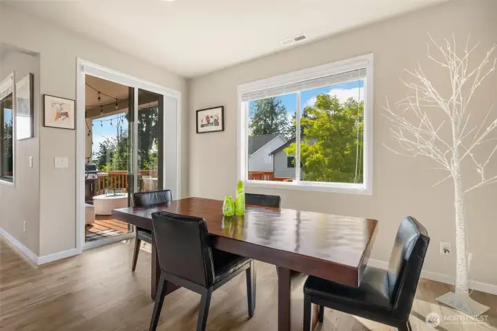 Dining room adjacent to kitchen and deck.