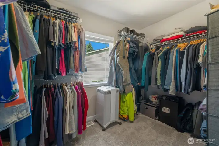Spacious walk-in closet in primary suite