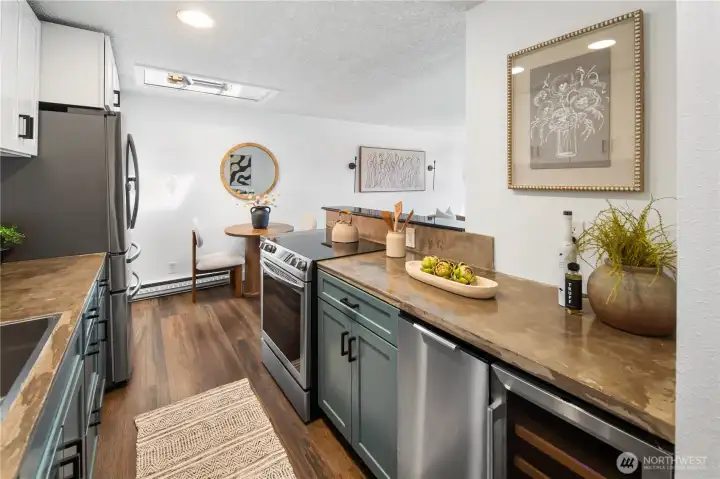 Kitchen updates include custom resurfaced countertops, new sink, fixtures, garbage disposal, and stainless steel appliance package Kitchen updates include custom resurfaced countertops, new sink, fixtures, garbage disposal, and stainless steel appliance package