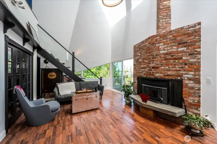 Main level living area with fireplace and access to the loft.