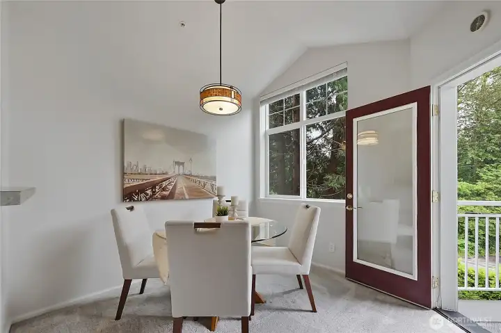 Generously sized dining room with access to the outside deck.