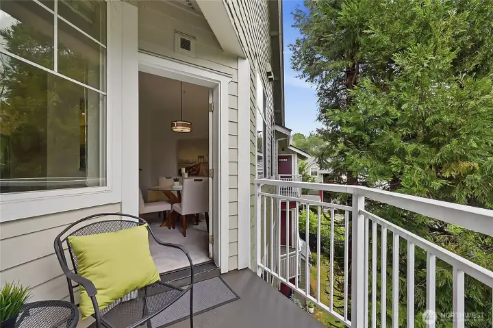 Lovely outside deck overlooking the mature landscaping- great spot for your morning coffee!