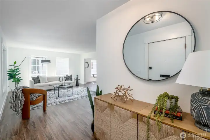 This home has a lovely entryway that leads into a spacious living room.