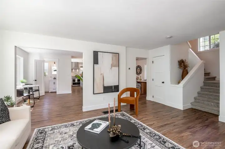 The main floor features a bright living room that flows seamlessly into a spacious dining room and kitchen creating the perfect setting for both entertaining and everyday living.