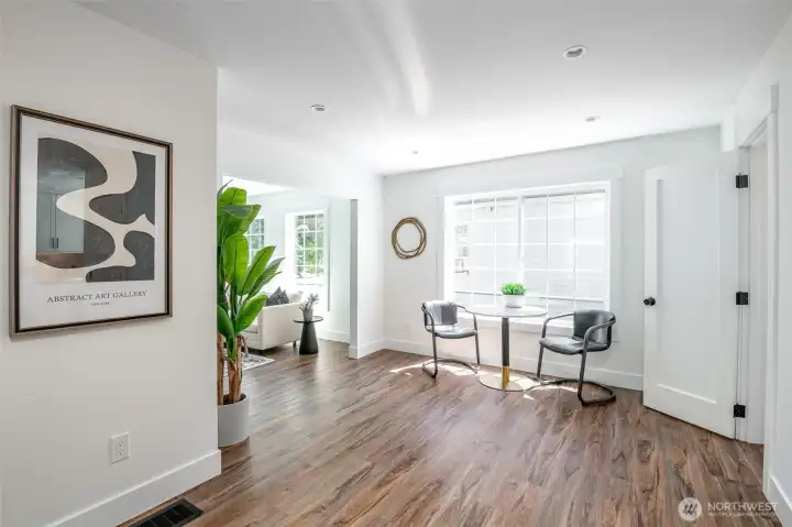 Lots of ways to use this corner - comfy chairs for morning reading or an office space.