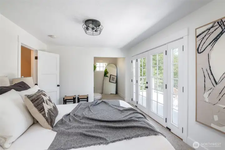 The primary bedroom has a walk-in closet and additional space which could be small office, reading nook, or extra closet.