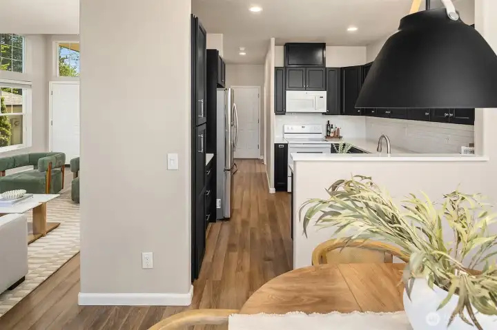 Seamless flow between the living space, kitchen, and dining area creates the perfect layout for everyday living and entertaining.