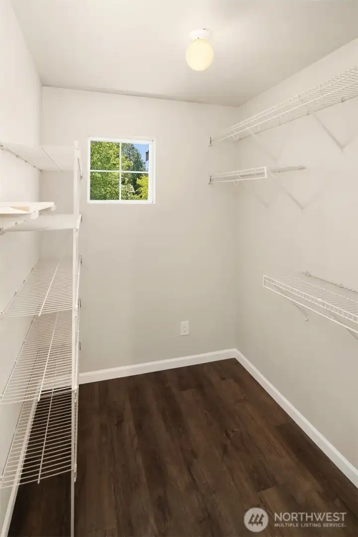 Primary walk-in closet.