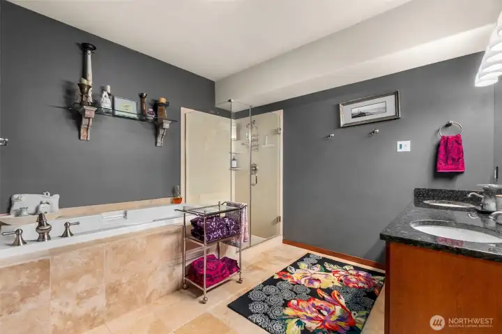 5-piece primary bathroom with walk in shower and soaking tub