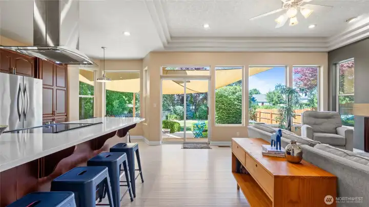 Informal living off kitchen and connected to patio doors