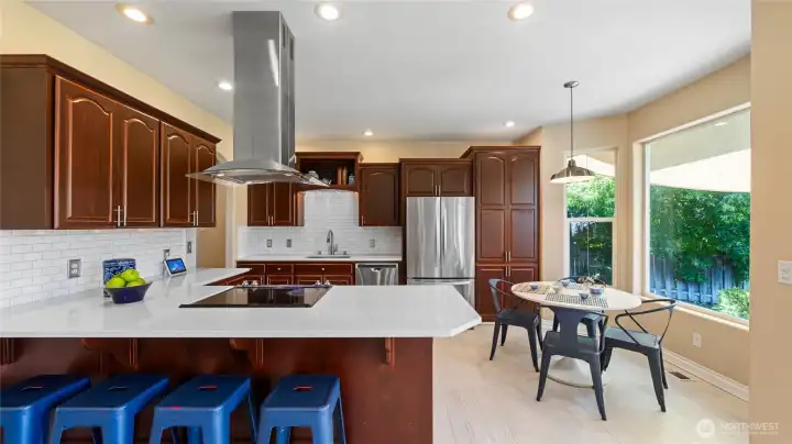 Kitchen with quality appliances and bar for seating