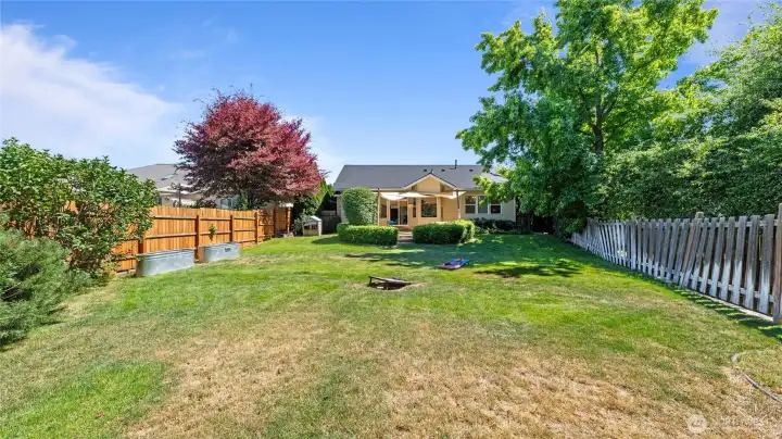 Backyard with raised gardens and fully fenced
