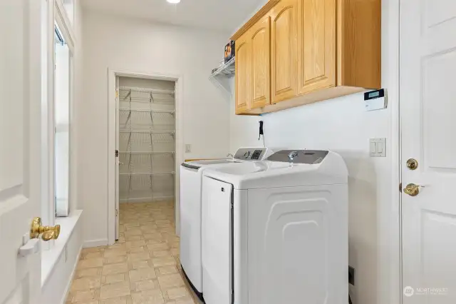 Utility room complete with sink, and the most incredible walk-in pantry at the far end!